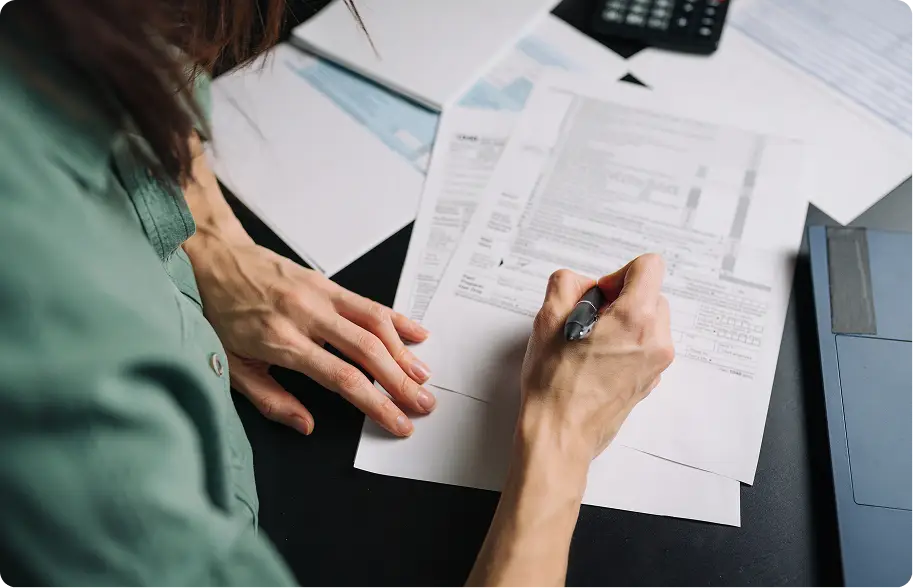 Person doing filling out tax form