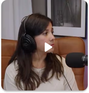 Women wasting headphones speaking into microphone