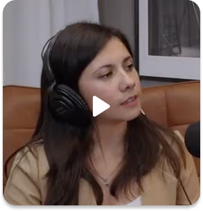 Women wasting headphones speaking into microphone