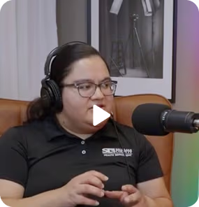 Women wasting headphones speaking into microphone